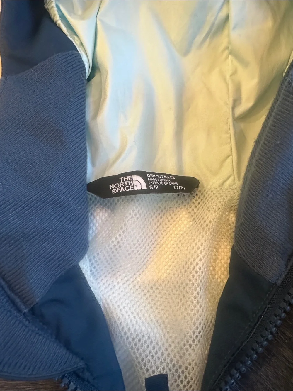 The North Face blue windbreaker jacket size 7/8 for boys and girls